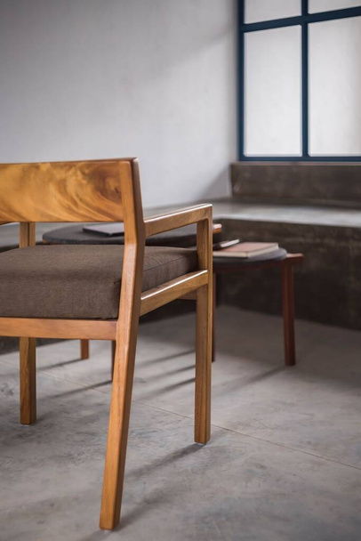 A vertical shot of a designer chair made of natural wood - Foto, imagen