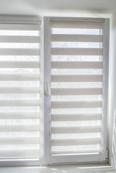 Window roller duo system day and night. Close up on roll curtains indoor - Фото, изображение