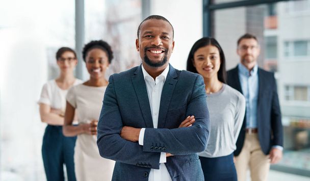 Professional, diverse and successful business team smiling and standing together in an office. Happy, formal and multiracial corporate staff, bank workers or businesspeople looking at camera - Photo, image