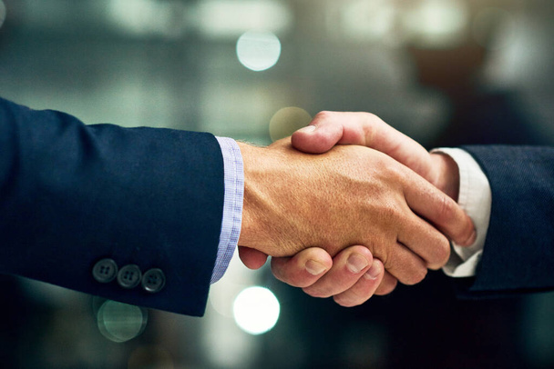 Business people giving handshake, congratulating on success and networking at work. Closeup of a professional corporate manager, boss or ceo hiring new employee, making deals and giving promotion. - Foto, Imagen