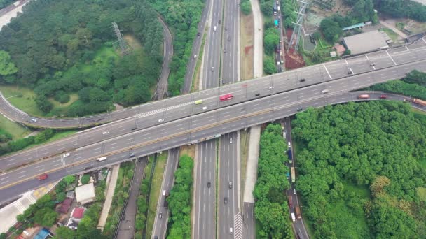 both ways traffic passing by fly over and Tomang Interchange in Jakarta. Top Down Aerial bird eye View. static position. - Video, Çekim