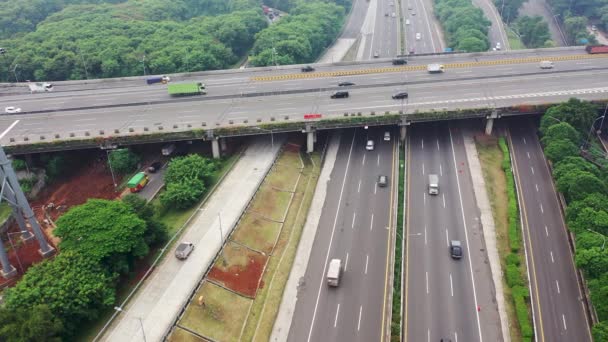 Bird Eye view with slider moton above high way of Jakarta with fast moving traffic. Aerial Drone shot. - Video, Çekim