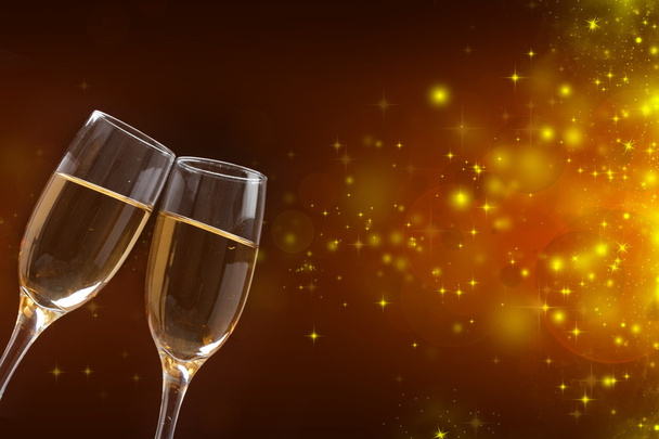 Champagne glasses against holiday lights - 写真・画像