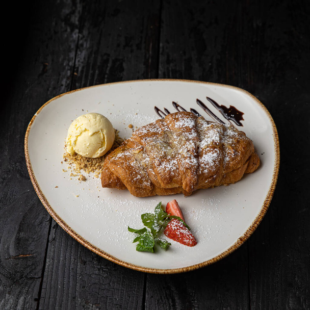 delicious baked pancakes with chocolate sauce on a wooden background - Foto, immagini