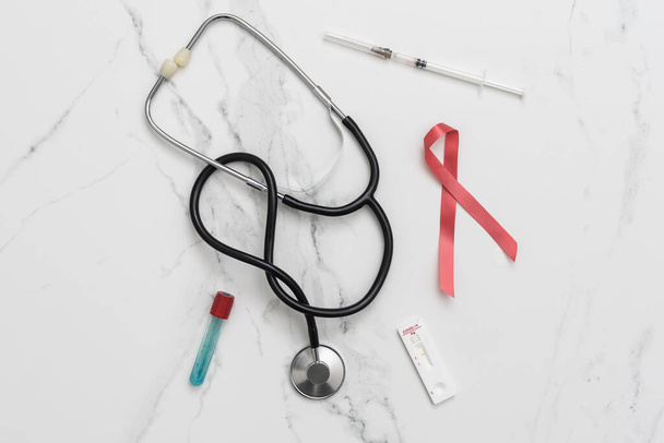 Medical layout on white background, flat lay. stethoscope or phonendoscope surrounded by vials, ampoules and test tubes - Φωτογραφία, εικόνα