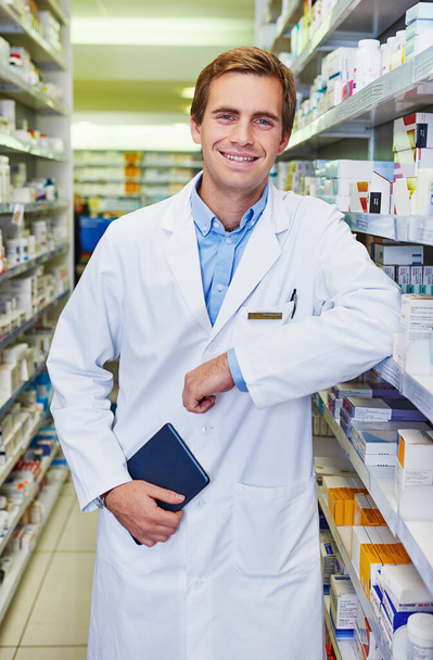 You can lean on me to keep you well. Portrait of a confident young pharmacist working in a pharmacy - Photo, image