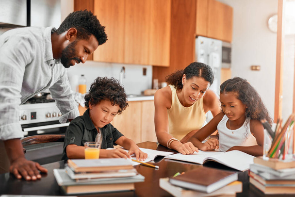 Play an active role in your childs homework. parents helping their two children with their homework - Valokuva, kuva