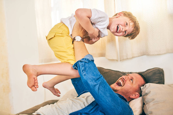 More than playtime, its bonding time. a happy little boy having fun with his father at home - 写真・画像