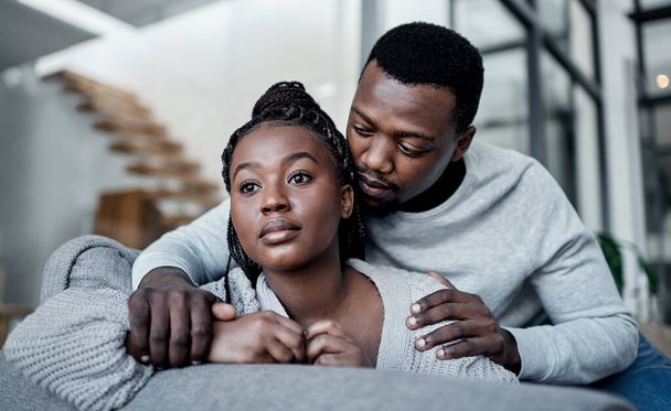 Unhappy, sad and depressed couple while boyfriend comfort, support and hug partner while struggling, mourning loss or depression problem at home. Asking forgiveness after argument about cheating. - Fotó, kép