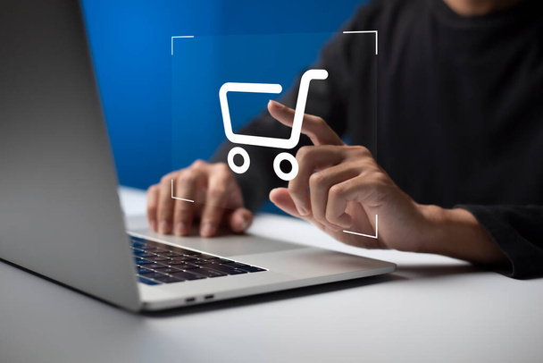 shopper using laptop and touch virtual screen online shopping. And online payment option or digital wallet online transaction concept. - Photo, Image