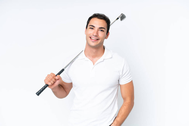 Young caucasian man isolated on white background playing golf - Valokuva, kuva