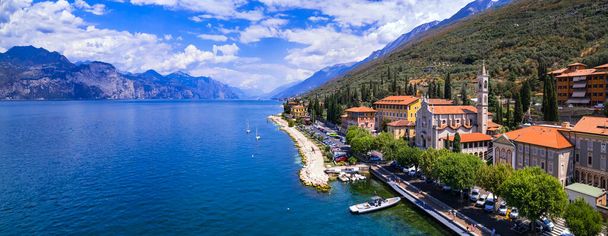 Scenic Lake Lago di Garda, Italy, aerial view of fishing village with colorful houses and boats - Castelletto di Brenzone. - Zdjęcie, obraz