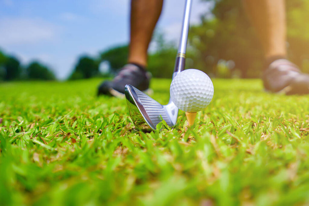 Golf ball on green grass ready to be struck on golf course. - Foto, Imagen