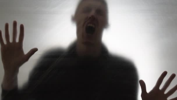 Blurred silhouette of a man. Horror or crazy concept. Mental health. - Metraje, vídeo