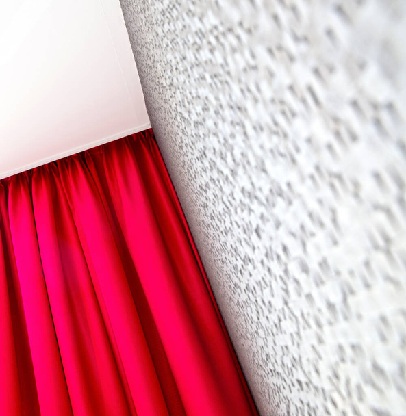 Wall and red curtain, selective focus on the corner - Photo, image
