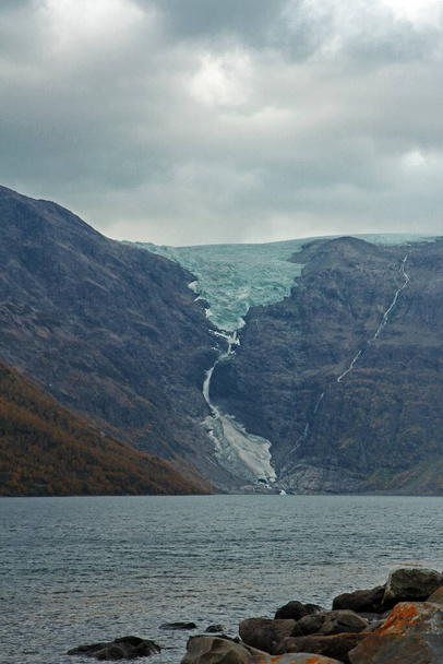Huge glacier melts into the sea. Exciting view of a glacial phenomenon in northern Norway. Cold and ice. - Photo, Image