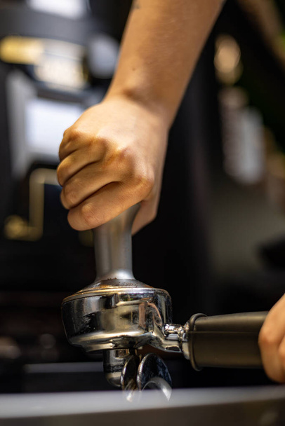 man pouring coffee from a grinder - Foto, Imagem