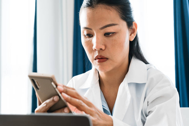 Asian woman doctor working online. High quality photo - Photo, Image