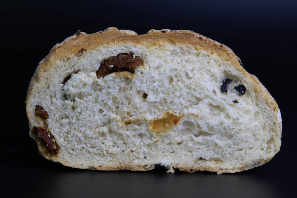 Delicious Mediterranean diet, Wheat Bread on Black Background - 写真・画像