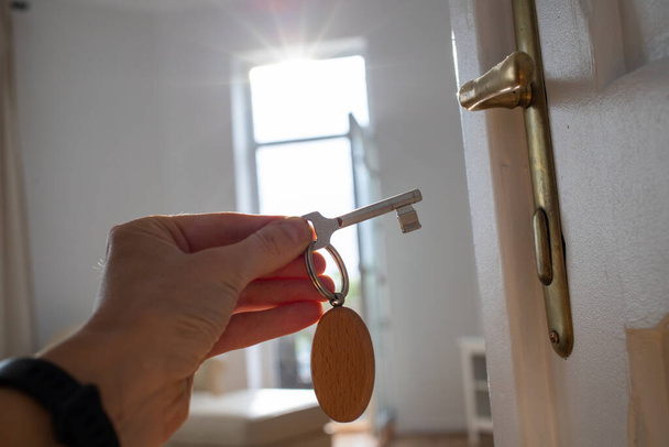 key opening white door to a modern home - Foto, Imagem