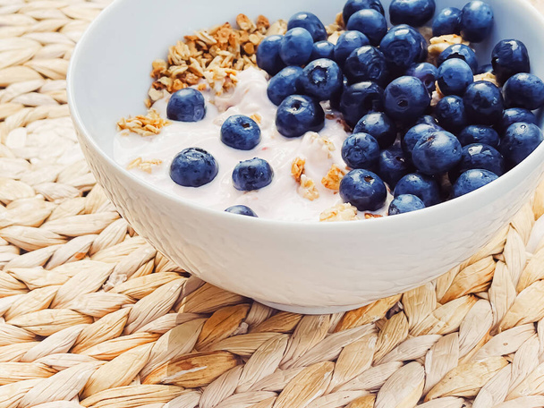 Blueberry yogurt cereal bowl as healthy breakfast and morning meal, sweet food and organic berry fruit, diet and nutrition concept - Foto, Bild