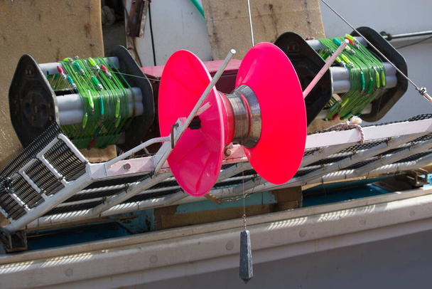 Brightly colored squid jigging machine - Photo, Image