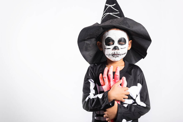 Halloween Kid. Child man horror face painting make up for ghost scary, Portrait of Asian little kid boy wearing skeleton costume studio shot isolated white background, Happy halloween day concept - Foto, Imagen