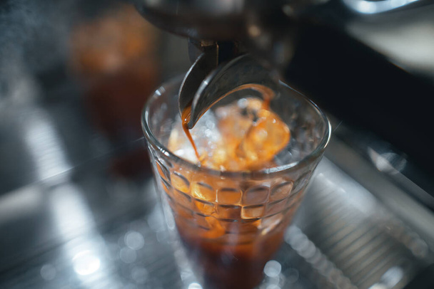 Closeup of hands barista make coffee,coffee from machine - Foto, Bild