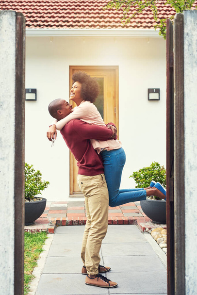 When a big dream turns into a reality. a young couple celebrating the move into their new house - Fotografie, Obrázek