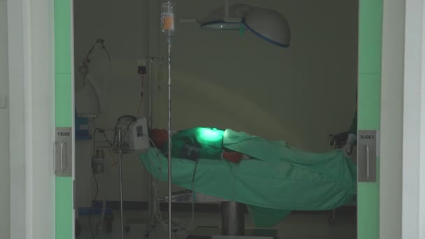 Team surgeon in uniform success surgery and walking go out from operating room at hospital, group of teamwork doctor walking go out the emergency room with diversity and ethnicity, medical concept. - Filmagem, Vídeo