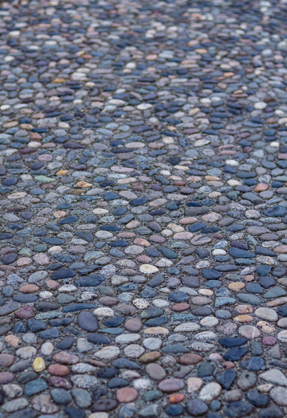 Massage stone walkway texture. A Textured Cobble Pavement, Reflexology. Pebble stones on the pavement for foot reflexology. The pebble stone floors. Nobody, copy space for text - Fotografie, Obrázek