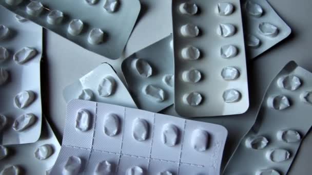 Many empty pill packages blisters of drug addicted people and drug abusing people as pharmaceutical painkiller and medical therapy overdose treatment for medical addicted people and dangerous overdose - Filmati, video