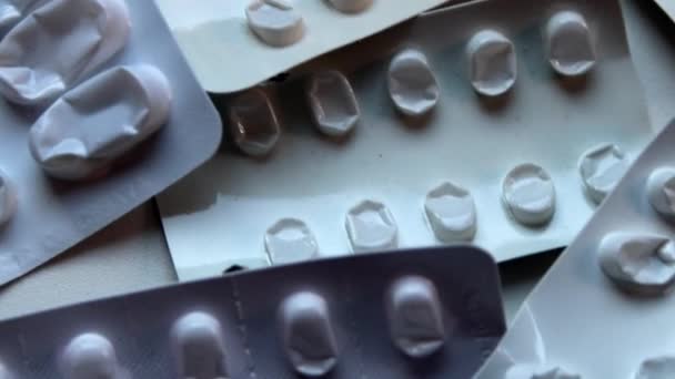 Many empty pill packages blisters of drug addicted people and drug abusing people as pharmaceutical painkiller and medical therapy overdose treatment for medical addicted people and dangerous overdose - Footage, Video