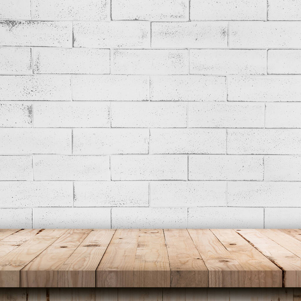 Empty wooden table top and white brick wall and rough crack background texture - Fotoğraf, Görsel