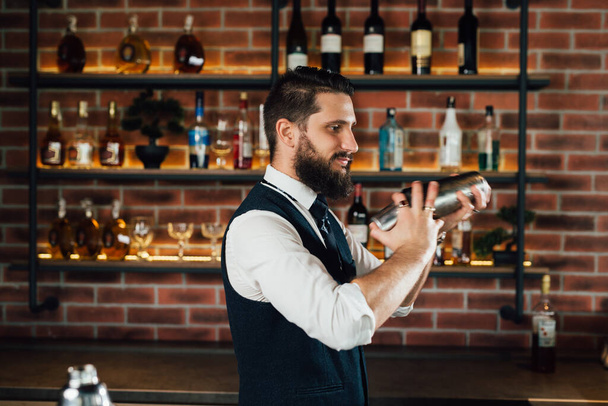 side view of barman shaking cocktails - Fotó, kép