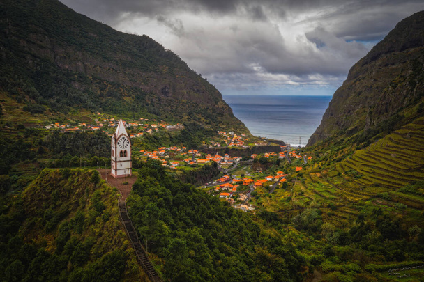 Sao Vicente or San Vicente, Madeira, Portugal - October 2021: The fragment view of Sao Vicente village from mountain. Catholic church on front. Aerial drone picture - Foto, Imagem