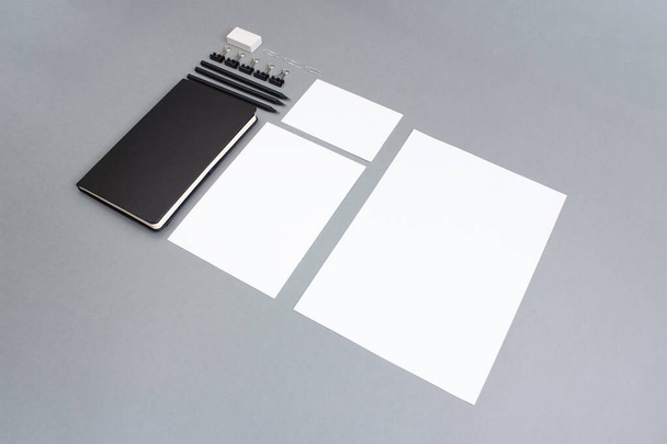 Business background. notebook and templates of different formats on a gray background. - Photo, Image