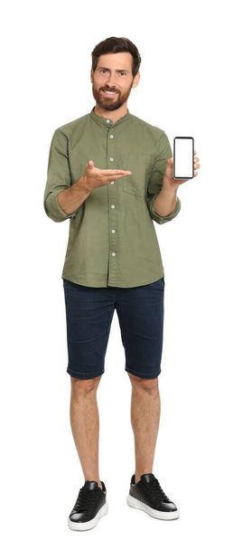 Happy man with phone on white background - 写真・画像