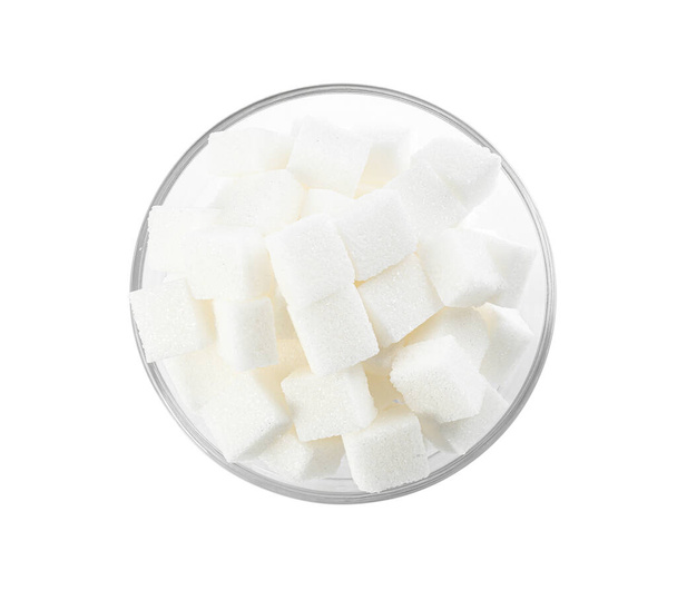 Bowl of sugar cubes isolated on white, top view - Foto, afbeelding