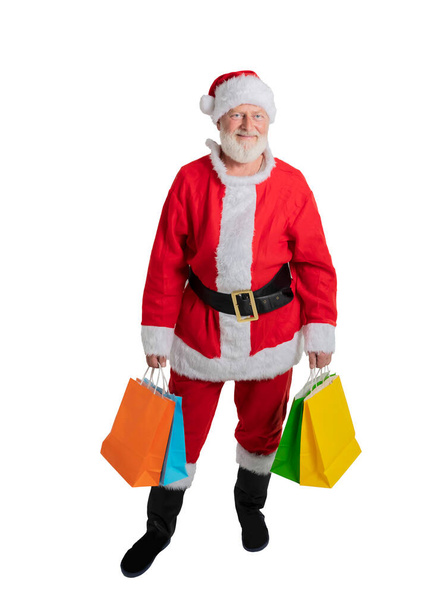 Santa Claus holds packages with gifts for Christmas on a white background - Foto, afbeelding