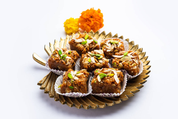 Dodha Barfi or Doda Burfi is a traditional Indian sweet, which has a grainy and chewy texture - Valokuva, kuva