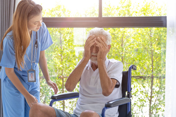 elderly senior man sick and sad cry with mental problem nurse support. Mental illness from health conditions. - Foto, Imagen