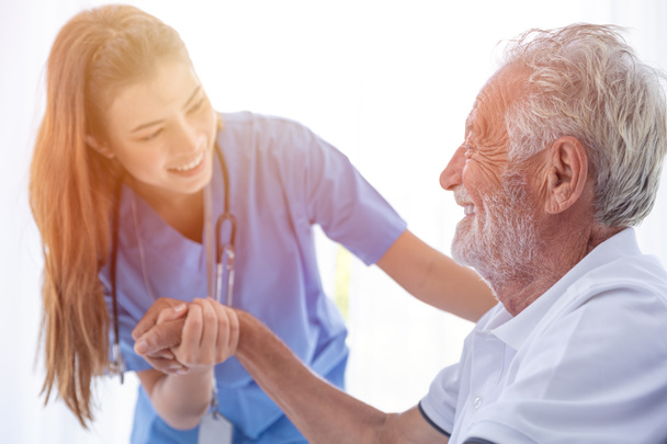 Nurse Medical Staff Worker Support Service Healthcare Senior Elder Man in Home Care happy smile looking together. - Фото, изображение
