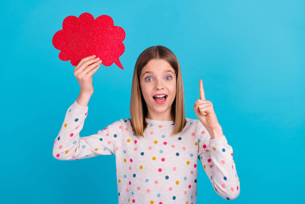 Photo of funny excited little lady dressed dotted pullover pointing finger red mind cloud empty space isolated blue color background. - Fotó, kép
