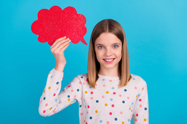 Photo of cute funny little lady dressed dotted pullover holding red mind cloud empty space isolated blue color background. - Foto, immagini