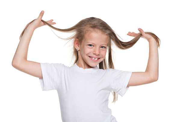 Smiling little girl with flowing hair - Фото, зображення