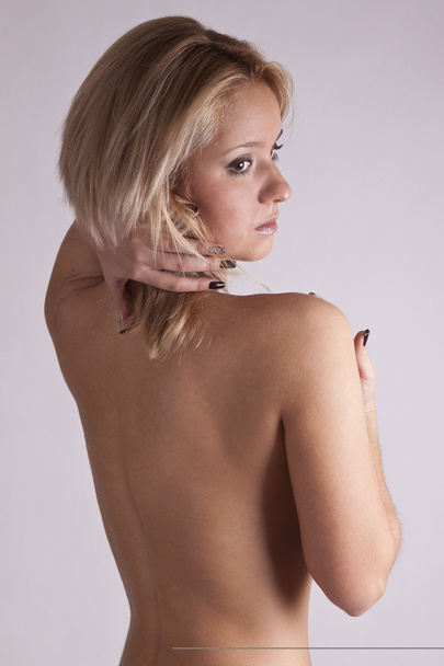 Pretty girl with bare back - Фото, зображення