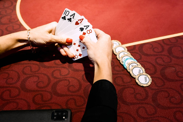 side view of men and women playing poker in a casino - Foto, imagen