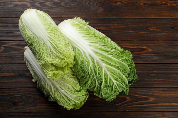 Fresh ripe Chinese cabbages on wooden table - Фото, зображення