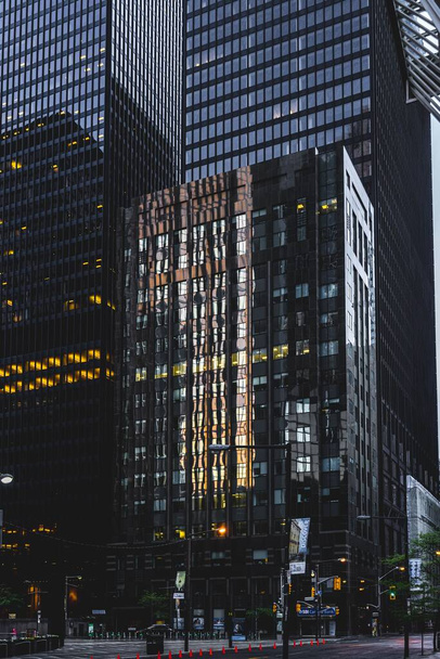 A vertical shot of the buildings in Downtown Toronto during the sunrise - Fotoğraf, Görsel